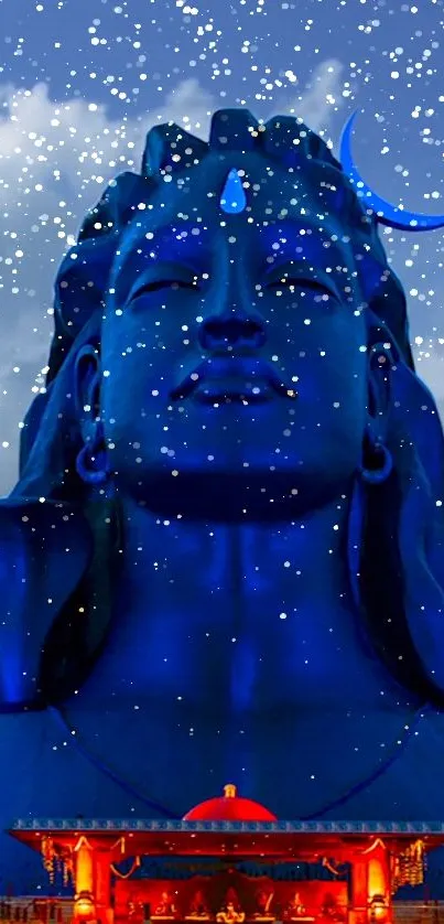 Majestic Shiva statue under starry night sky.