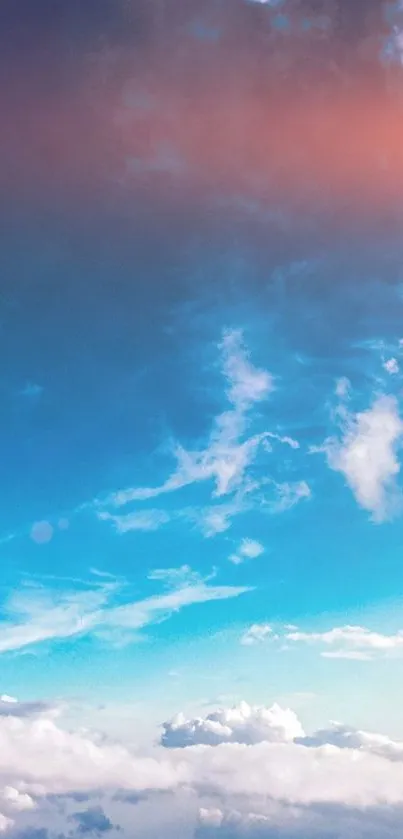 Breathtaking sky view with clouds and a serene blue to pink gradient.