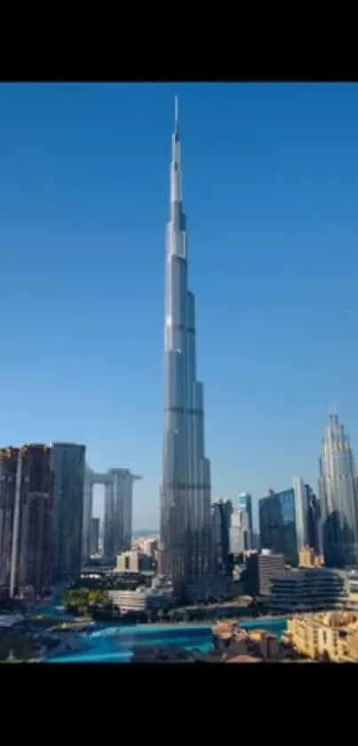 Tall skyscraper with blue sky and cityscape background.