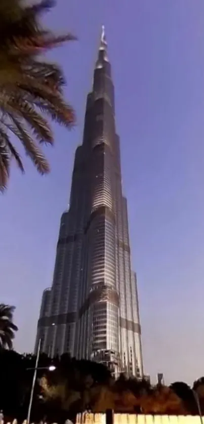 A towering skyscraper under a vibrant sky.