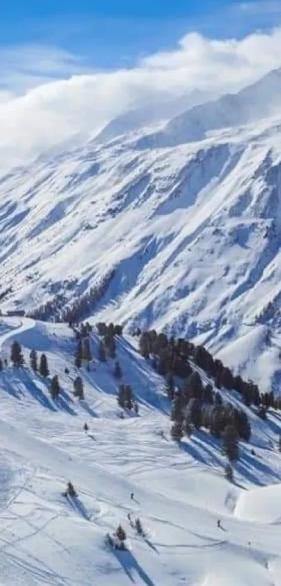 Snowy mountain landscape with blue sky and sun.