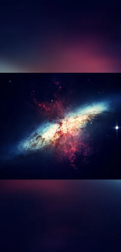 Vibrant galaxy wallpaper with stars and nebulae in dark blue and red hues.