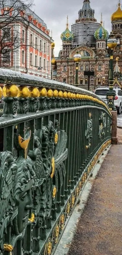 Cityscape with a historic cathedral and ornate bridge.