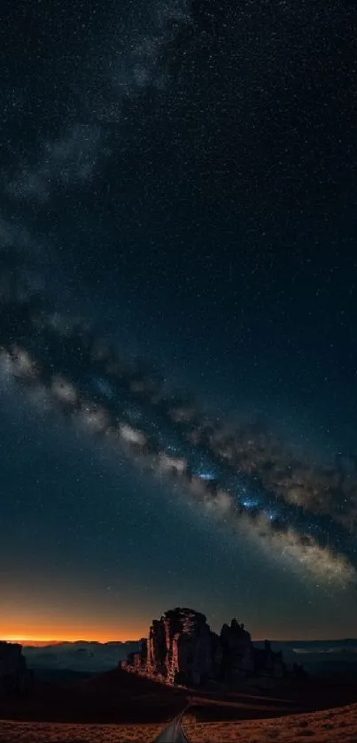 Starry night sky wallpaper with galaxy over a road.