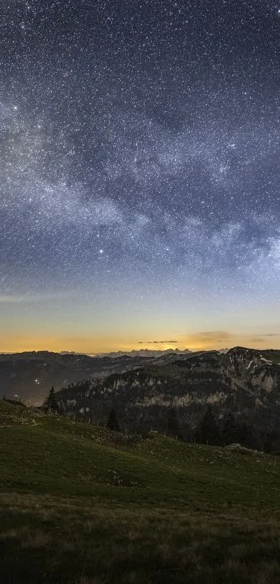 Starry night sky over a mountain landscape with a serene view.