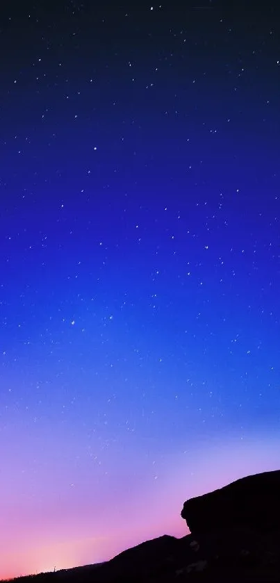 Starry night sky with twilight gradient and silhouette.