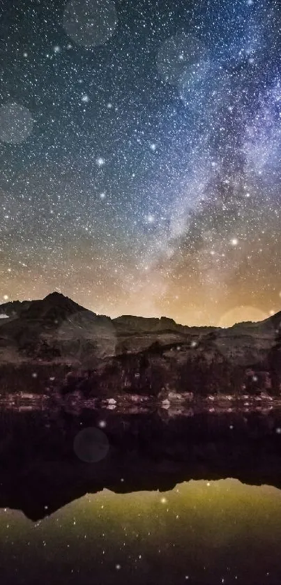 Starry night sky with Milky Way over silhouetted mountains.