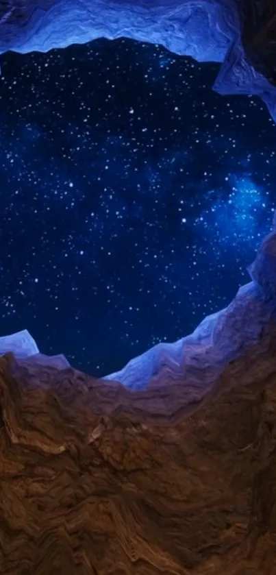 Starry sky seen through a rocky cave opening, set against a deep blue night.