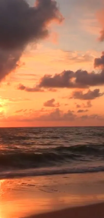 Beautiful beach sunset with vibrant orange sky and ocean waves.