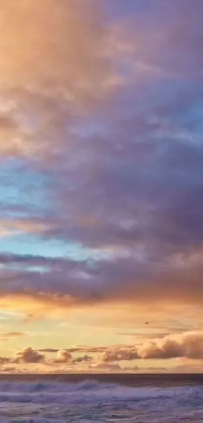 Beautiful sunset over the ocean with vibrant sky and clouds.