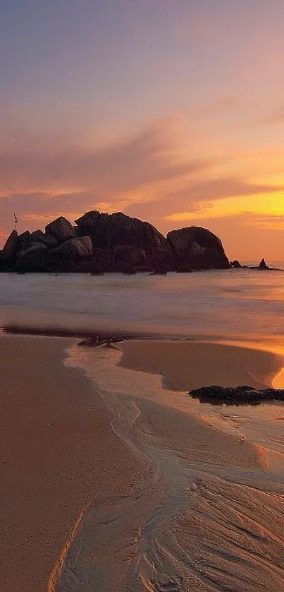 Scenic sunset over a calm beach with gentle waves and an orange sky.