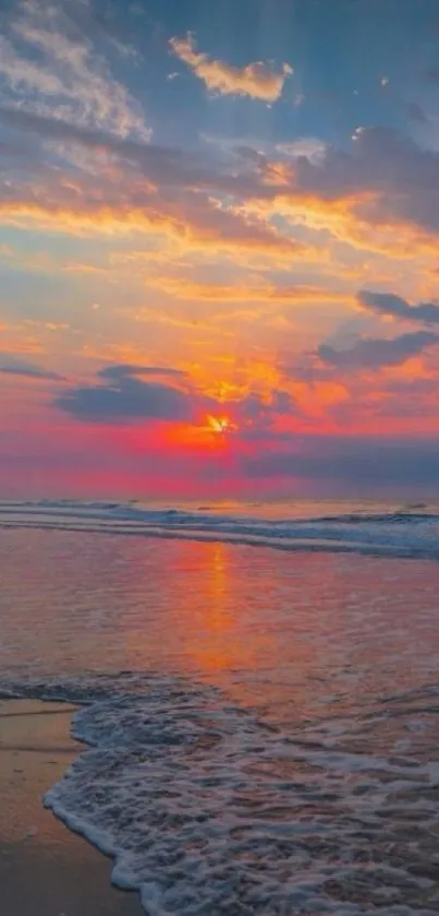 A vibrant sunset over a tranquil beach with ocean waves and colorful sky.