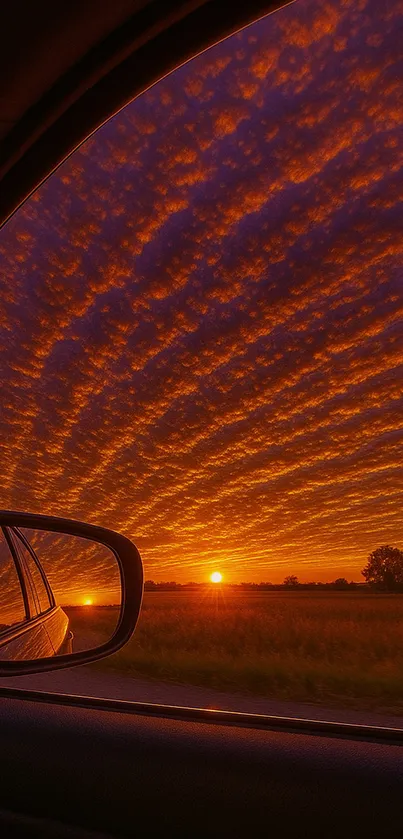 Breathtaking sunset view through a car window with vibrant skies.