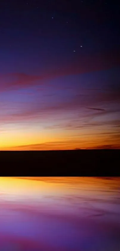 Vibrant sunset horizon with purple reflection and evening sky.