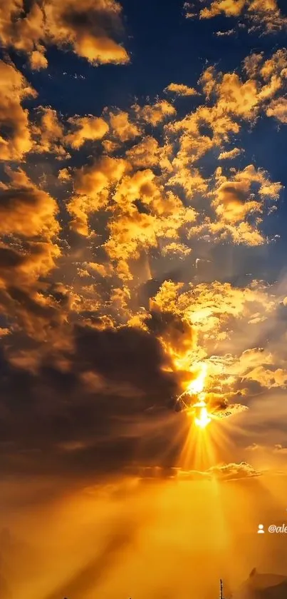 Golden sunset with dramatic clouds in vibrant sky.