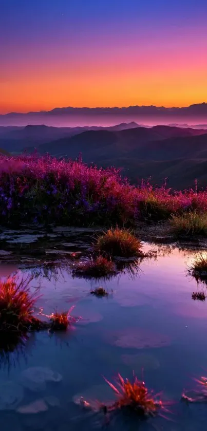 Vivid purple sunset over mountains and water reflection.