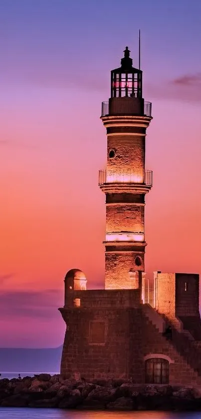 Lighthouse at sunset with a vibrant purple sky and calm sea.