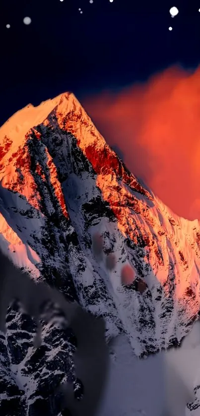 Sunset light over a majestic snowy mountain peak.