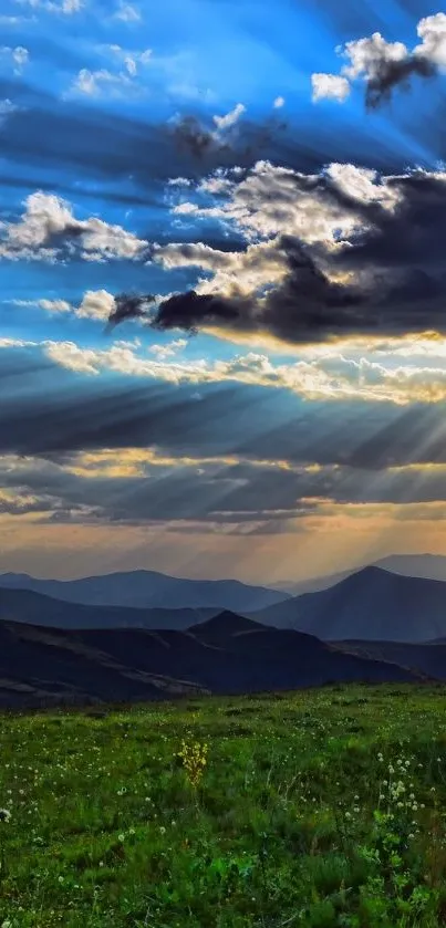 Sunset over mountains with dramatic clouds and colorful sky.