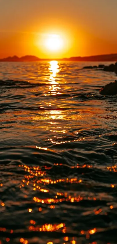 Stunning sunset over the ocean with golden reflections.