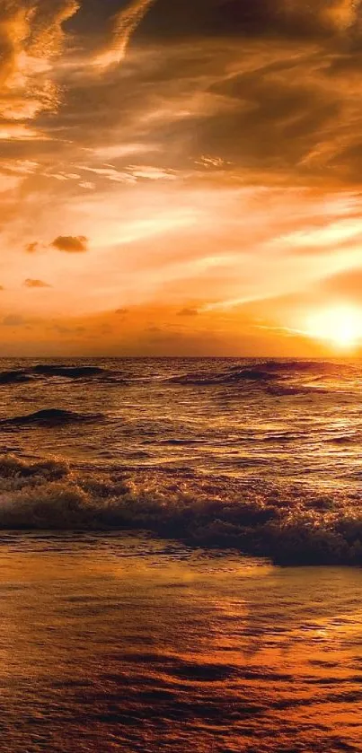 Golden sunset over ocean waves with a serene sky.