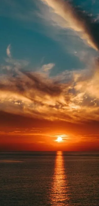 Stunning ocean sunset with vibrant sky over calm waters.