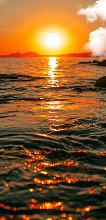 Golden sunset over ocean with reflecting waves, serene and vibrant.