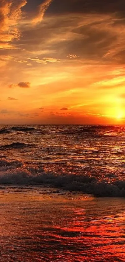 A stunning sunset over ocean waves with vibrant orange hues filling the sky.