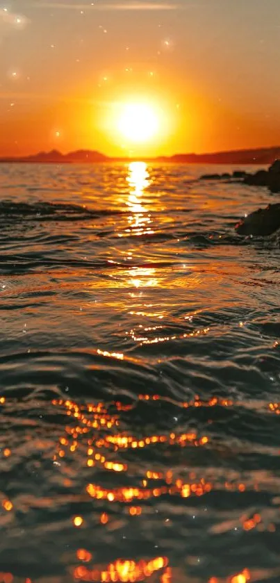 Sunset over ocean waves with golden reflections.