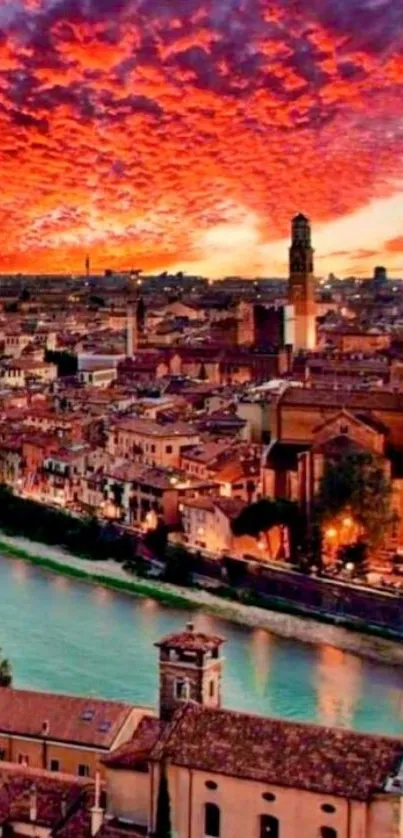 Fiery sunset over cityscape with river and historical buildings.