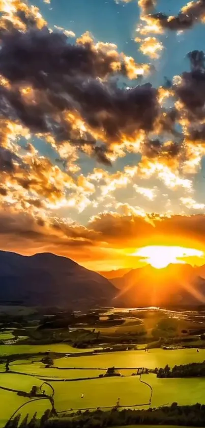 Sunset over lush fields with radiant sky and clouds.