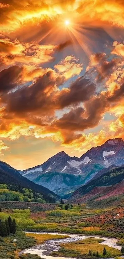 Breathtaking sunset over mountains and valley, vibrant orange sky.