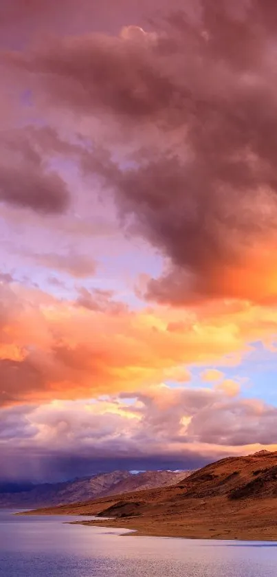 Stunning sunset over mountains with vibrant clouds.