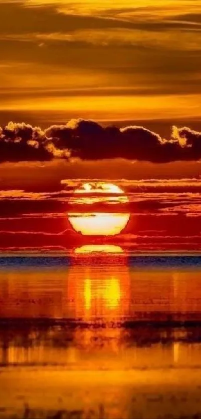 Breathtaking orange sunset reflecting on calm water.