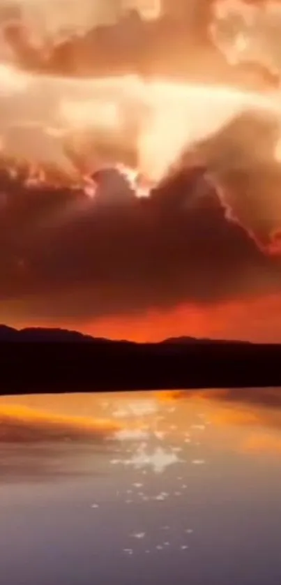 Captivating sunset with glowing orange sky reflected on calm water surface.