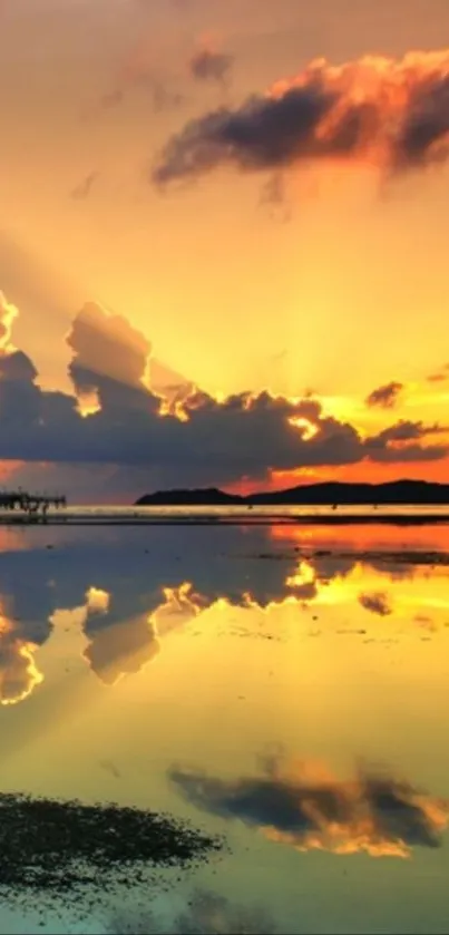 Stunning sunset with vibrant reflections on calm water surface.