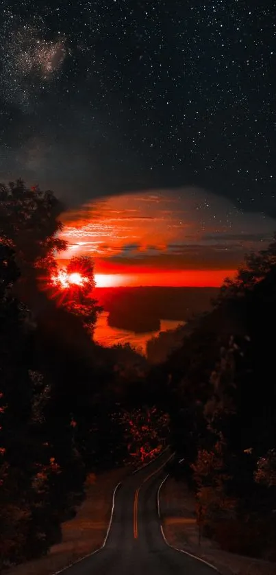 Sunset over a road with orange skies and starry night backdrop.