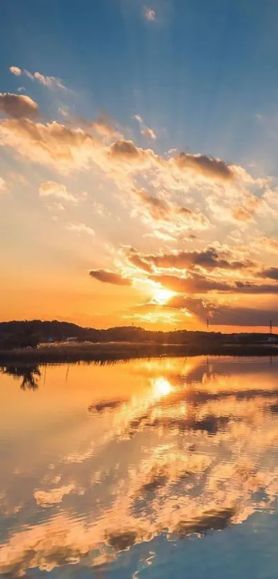 Serene sunset with reflections over calm water under a vibrant sky.