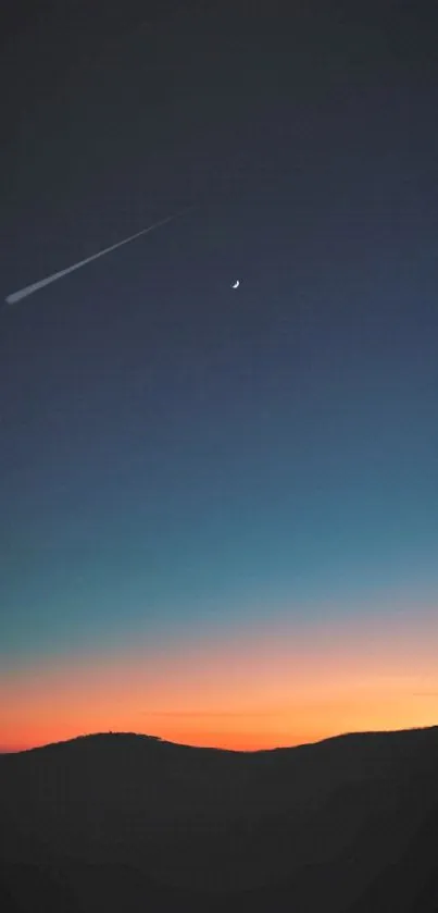 A vibrant sunset over hills with a crescent moon in the sky.