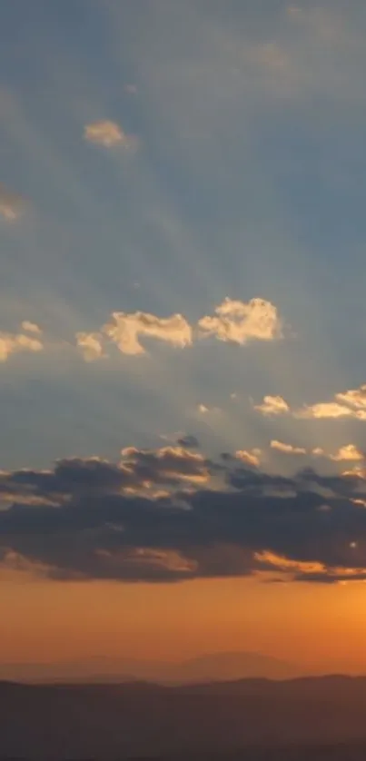 Stunning sunset sky with golden hues and soft clouds on the horizon.