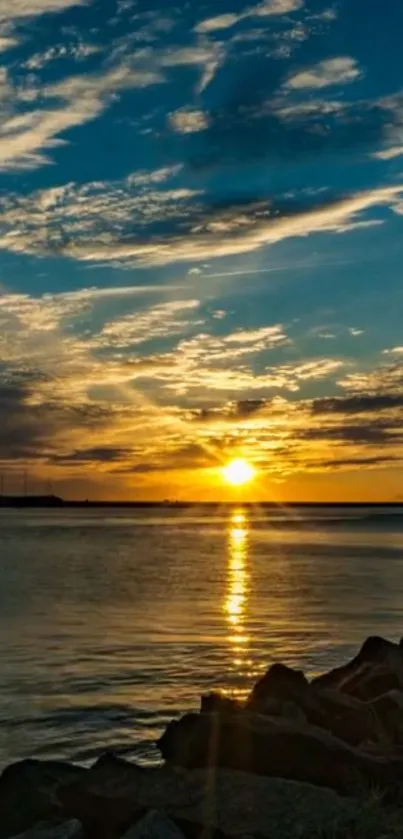 Serene sunset over ocean with vibrant sky.