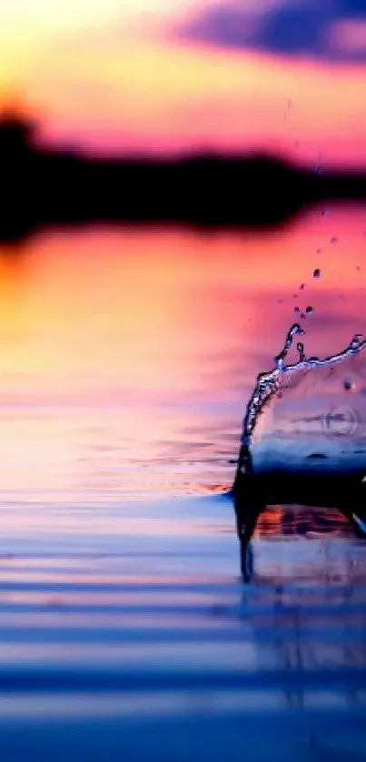 Vibrant sunset reflecting on a tranquil lake with ripples.