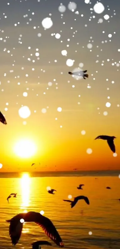 Birds flying across a sunset sky over a calm ocean with gentle waves.