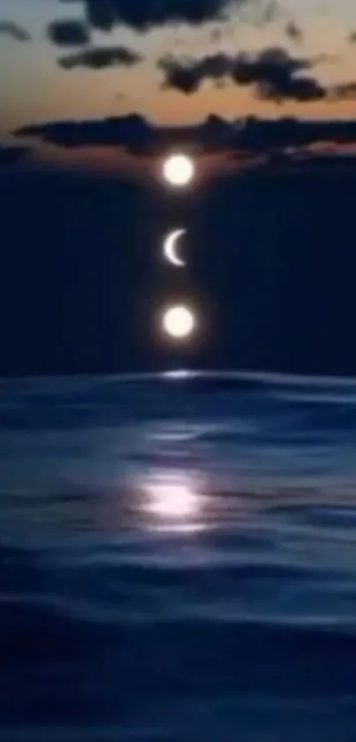 Mobile wallpaper of sunset and moon reflecting on dark ocean waters.