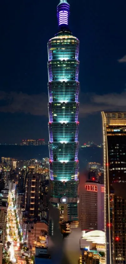 Taipei 101 towering above city at night.