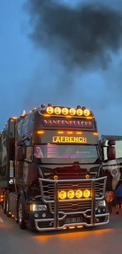 Night scene of an illuminated truck with glowing lights and a dark sky.