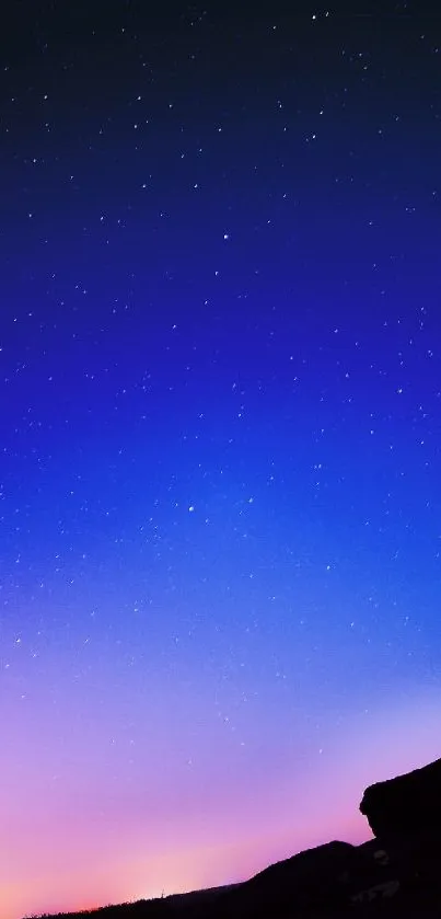 Twilight sky with a vivid gradient and stars in a serene landscape.