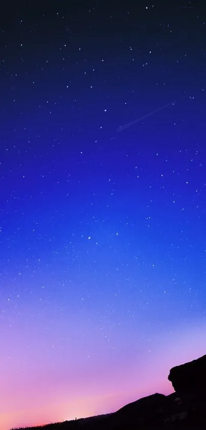 Twilight sky with stars over horizon, perfect for mobile wallpaper.