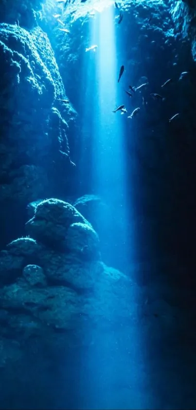 Underwater scene with sunbeam illuminating deep ocean blue hues.