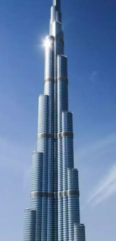 Skyscraper under a clear blue sky, showcasing modern architecture.